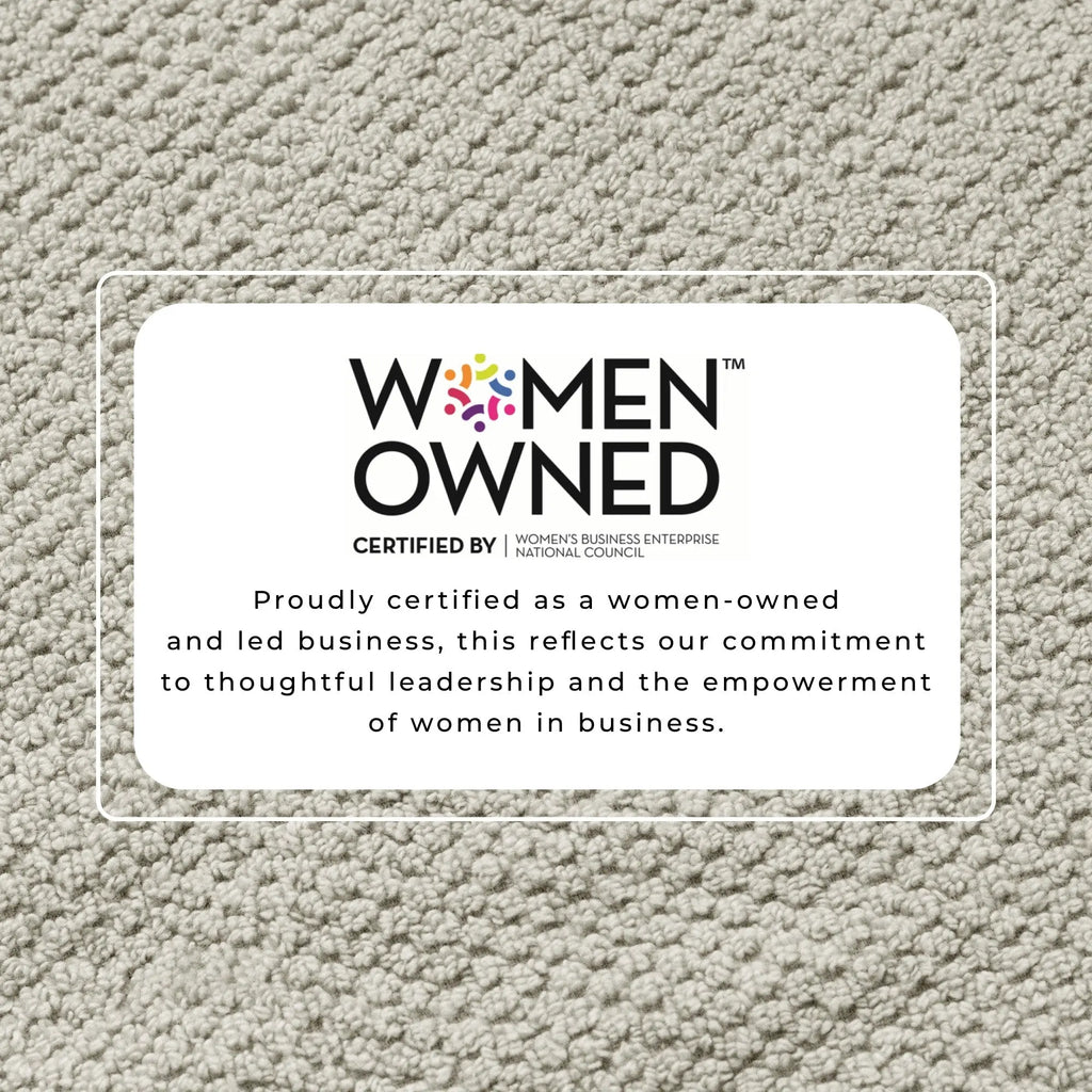 100% cotton bath towel set Marbella Collection; beige textured background with a women-owned certification badge.