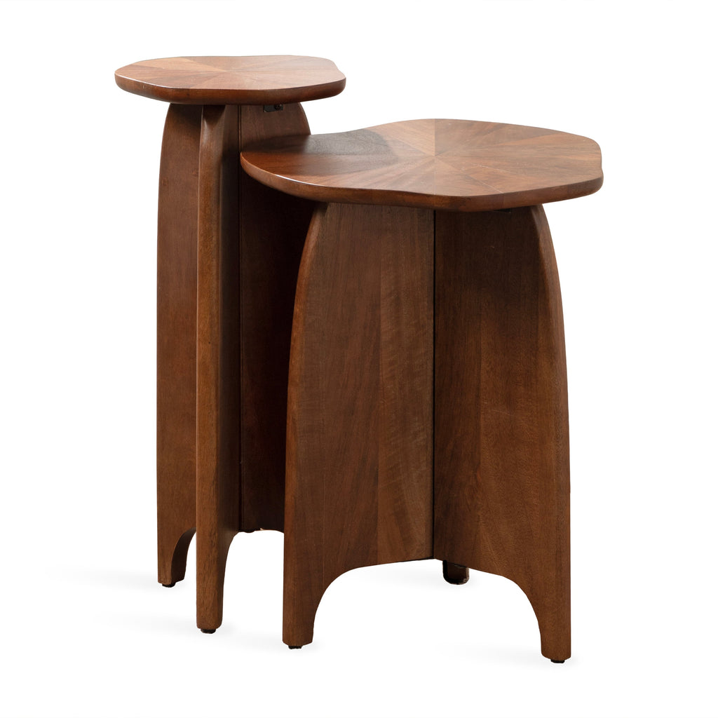 Two-piece mango wood nesting tables with sculptural curved bases, organic wavy edges, and sunburst wood tabletops.