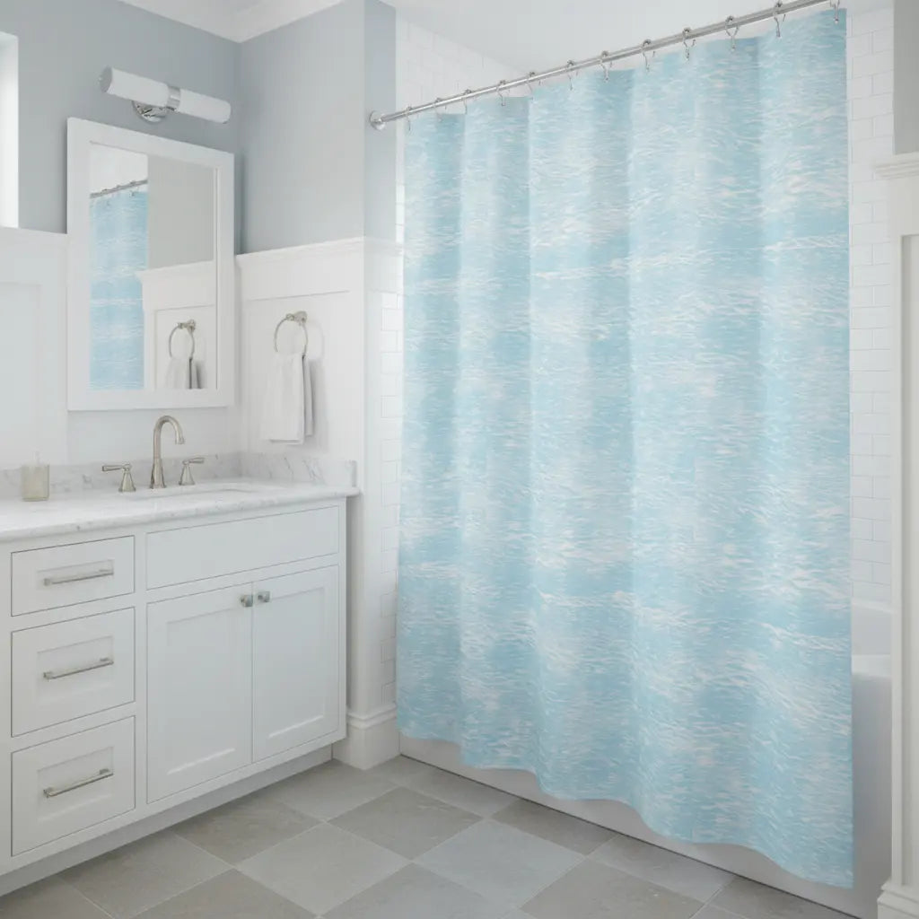 Coastal Tide Shower Curtain with light blue water texture brightens a white bathroom.