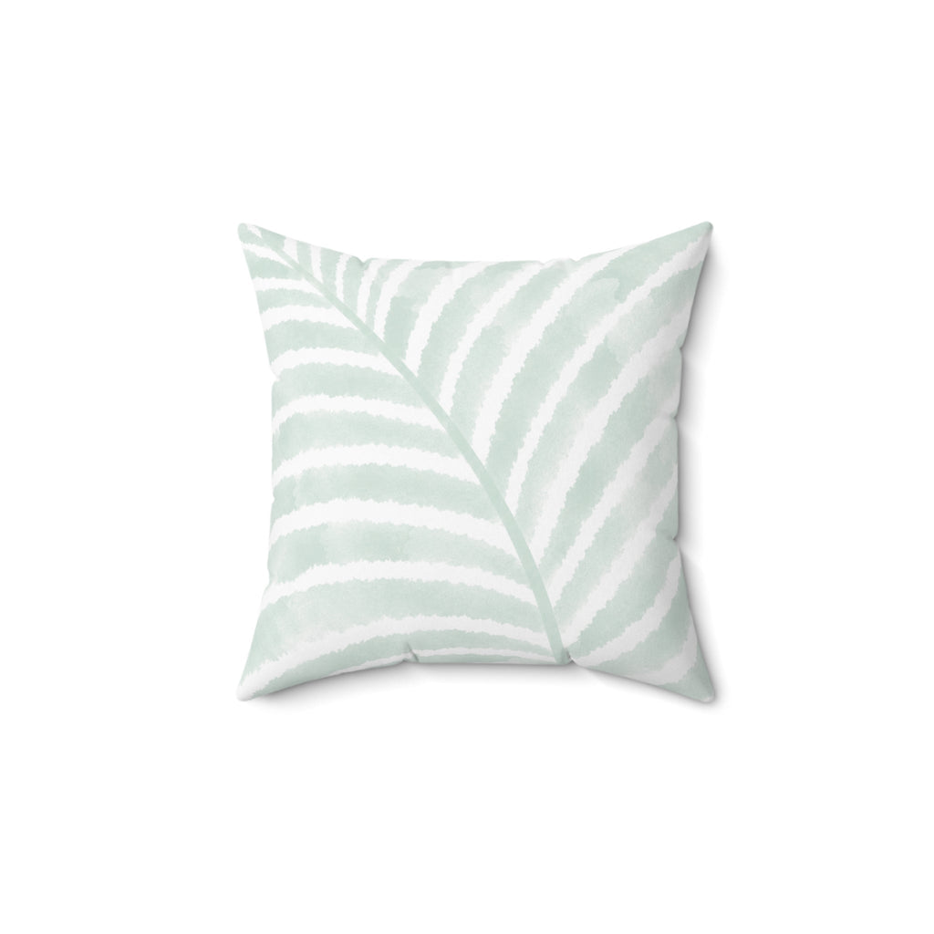 Soft mint green and white palm leaf throw pillow with a tropical coastal pattern