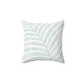 Soft mint green and white palm leaf throw pillow with a tropical coastal pattern