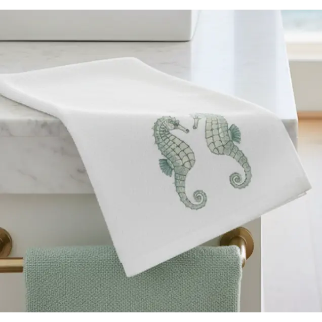 Mint Seahorse Face Towel with mint seahorse embroidery on white washcloth for coastal bathroom decor.