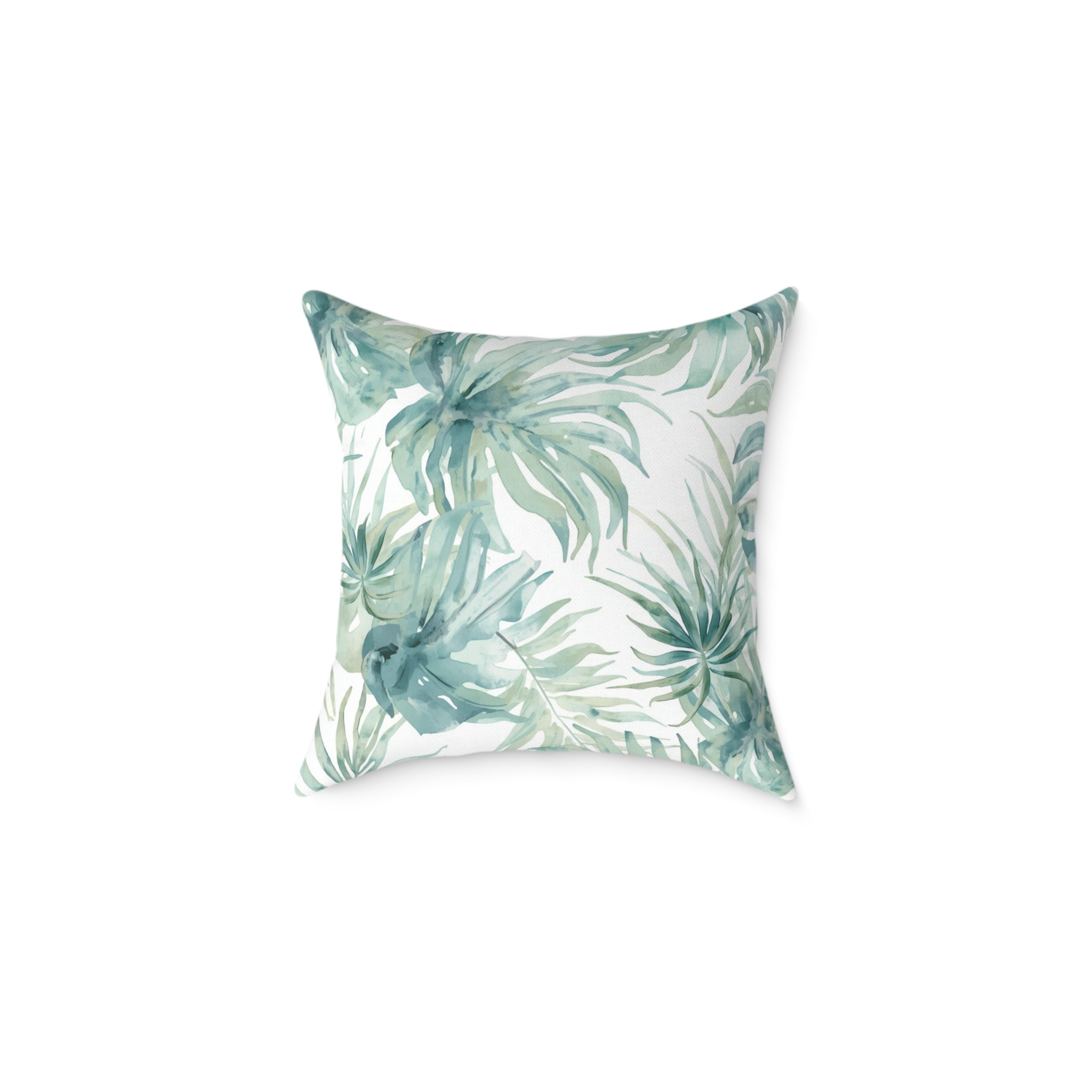Watercolor palm leaf cushion in cool blue shades for neutral coastal sofa decor