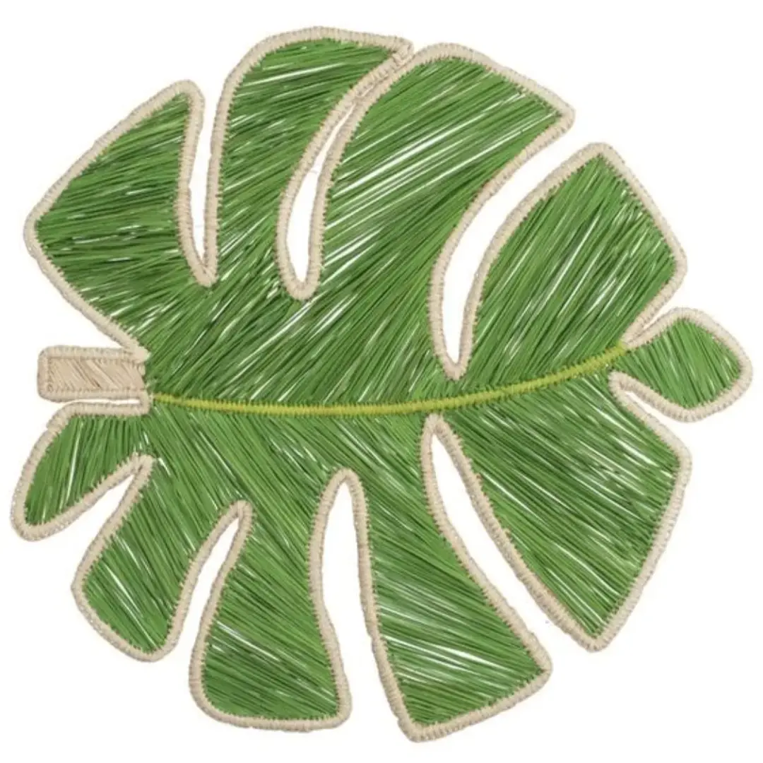 Monstera leaf Iraca palm placemat styled in a tropical tablescape with natural decor