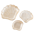 Coastal jewelry dish with a scallop shell design and luminous finish.