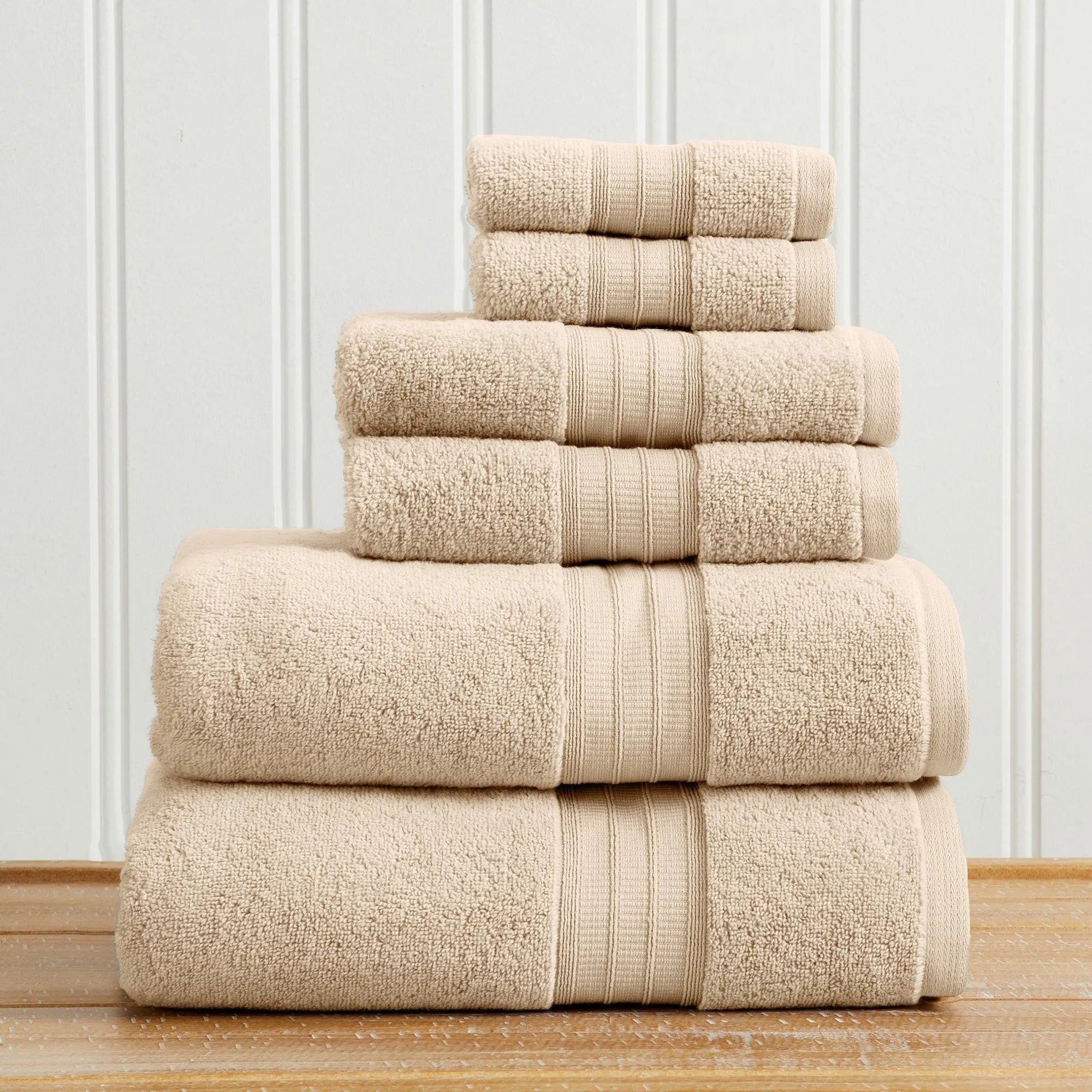 Great Bay Home bath towel set, Chiara Collection, 100% cotton, beige towels stacked.