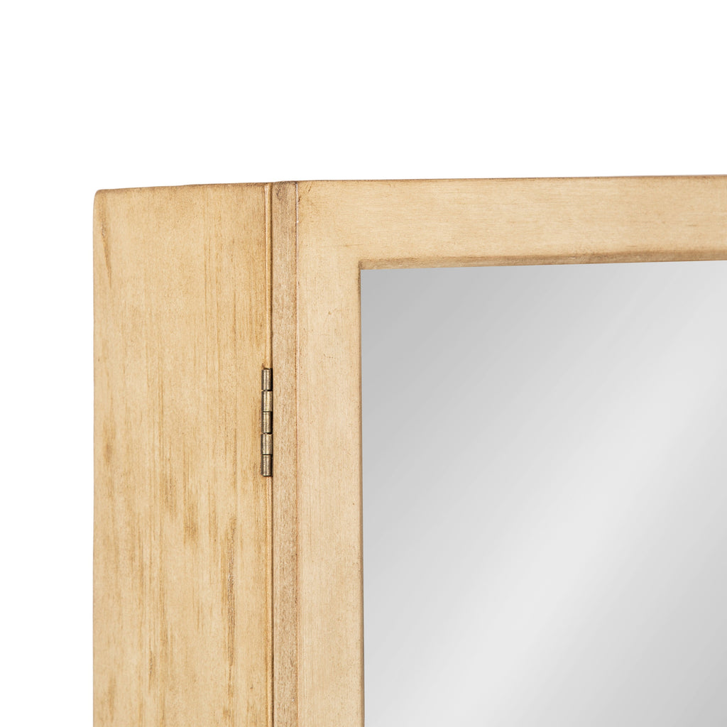 Natural wood bathroom mirror storage cabinet with a cane-front lower detail and hinged door