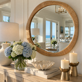 Natural wood-tone rattan mirror with a softly curved organic frame.