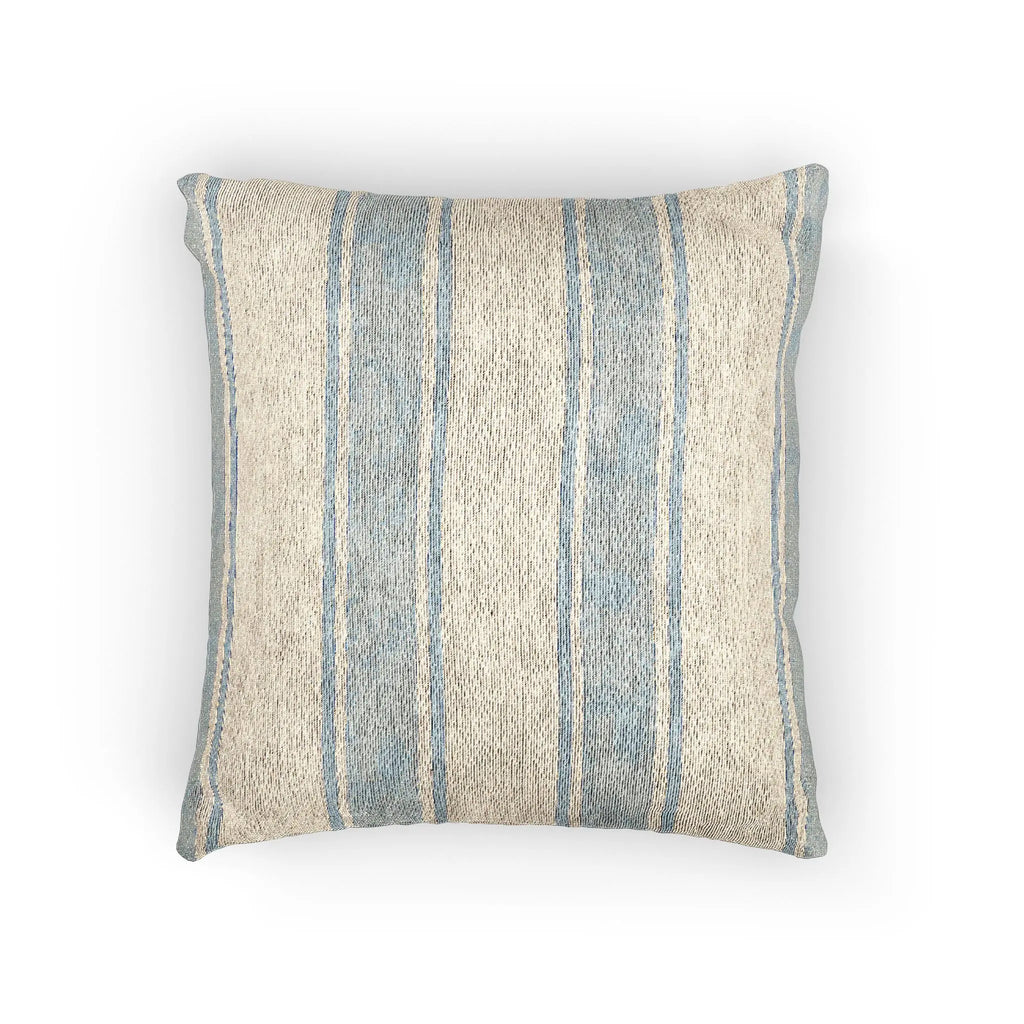 Coastal blue and white striped woven pillow with textured weave for beachy living spaces.
