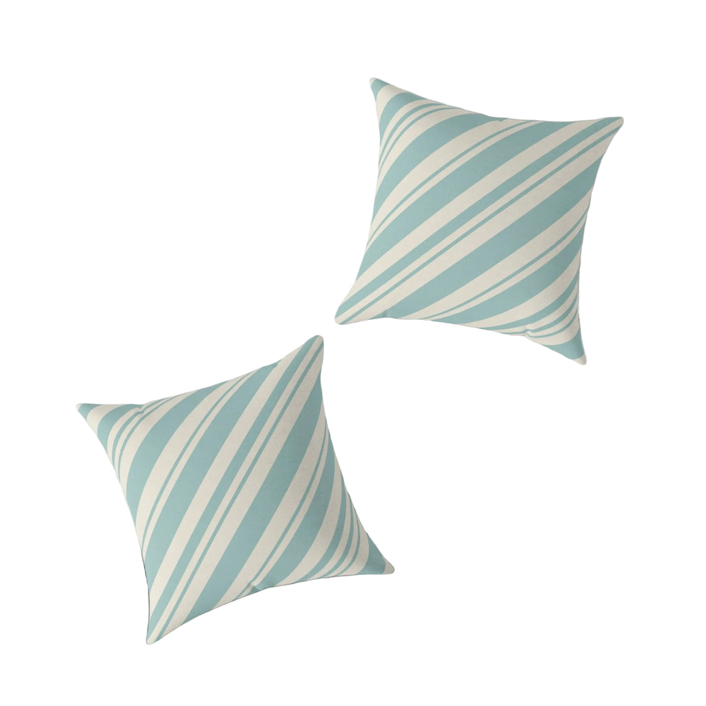 Nautical holiday throw pillow with wide blue and cream stripes in a relaxed, seaside style