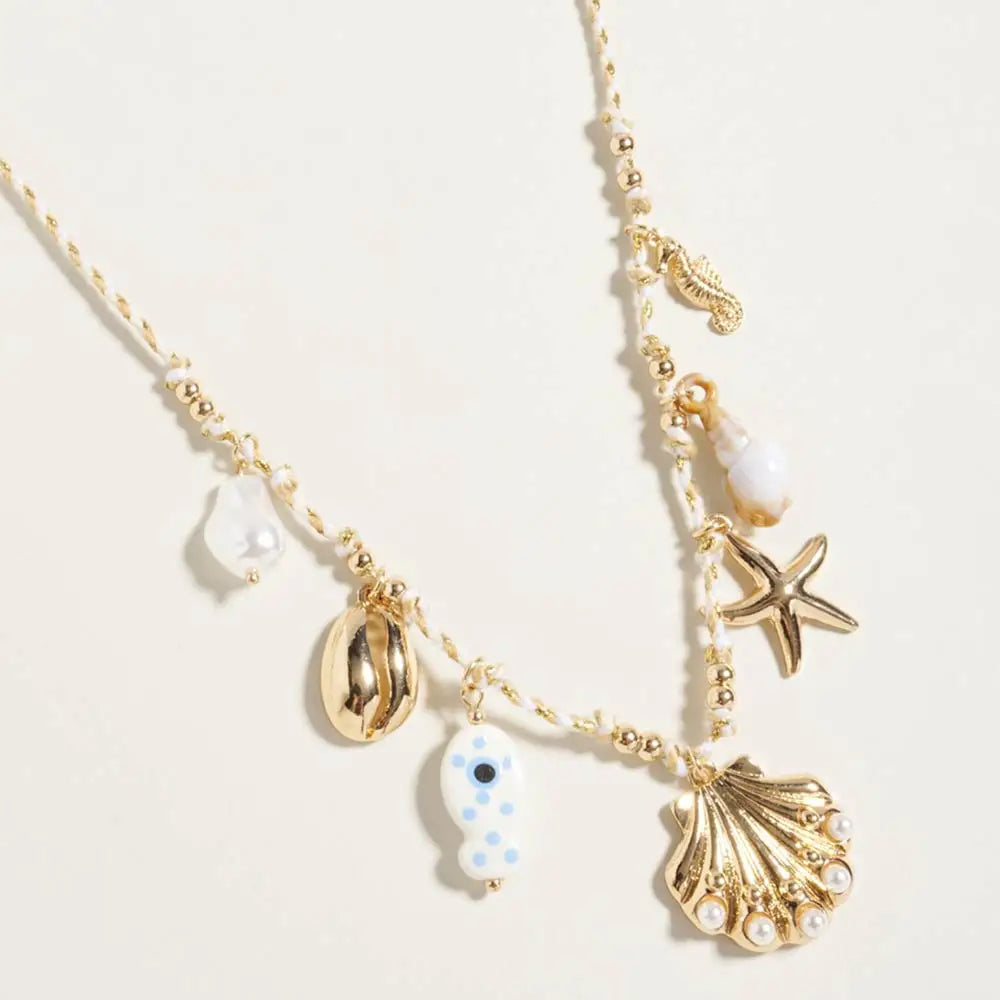 Ocean-inspired twisted fabric chain necklace featuring pearl seashell, starfish and seahorse charms