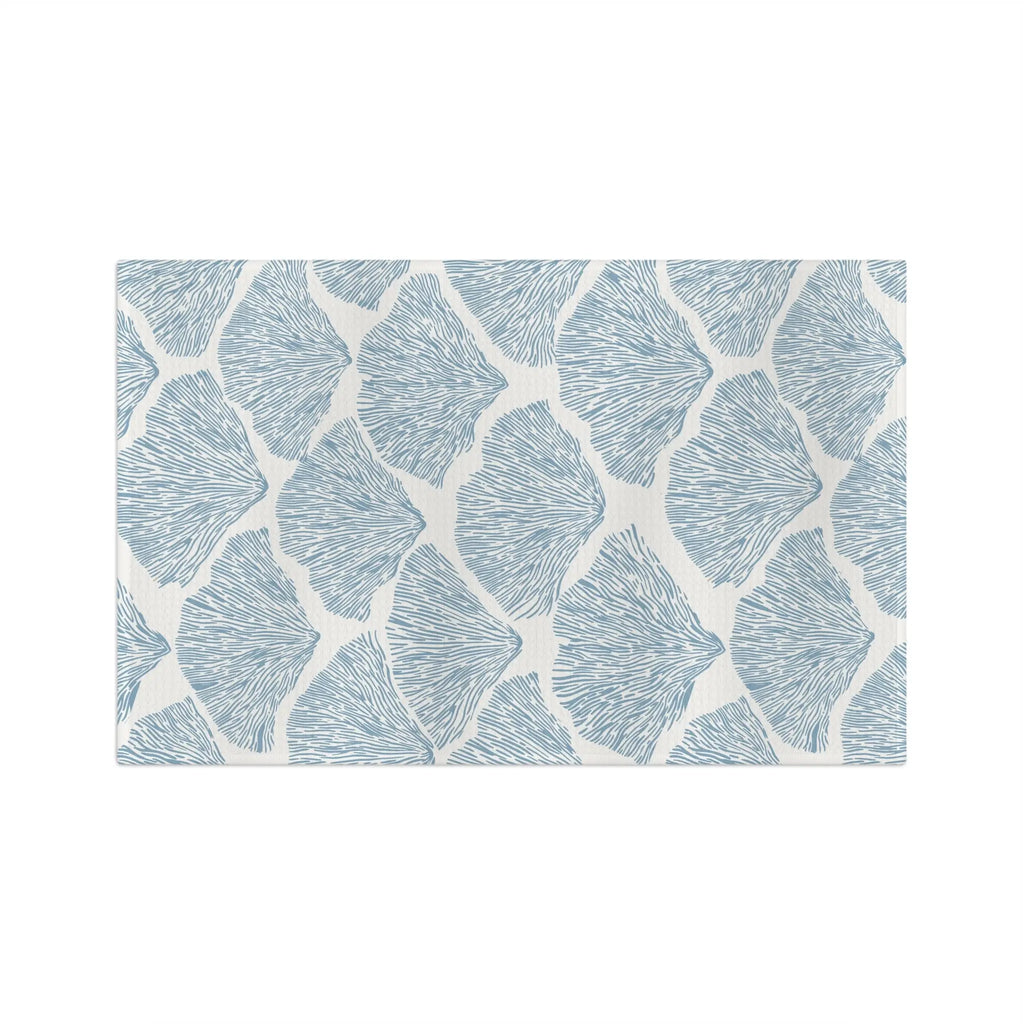 Blue Seashell Microfiber Tea Towel with a repeating seashell pattern on a cream background
