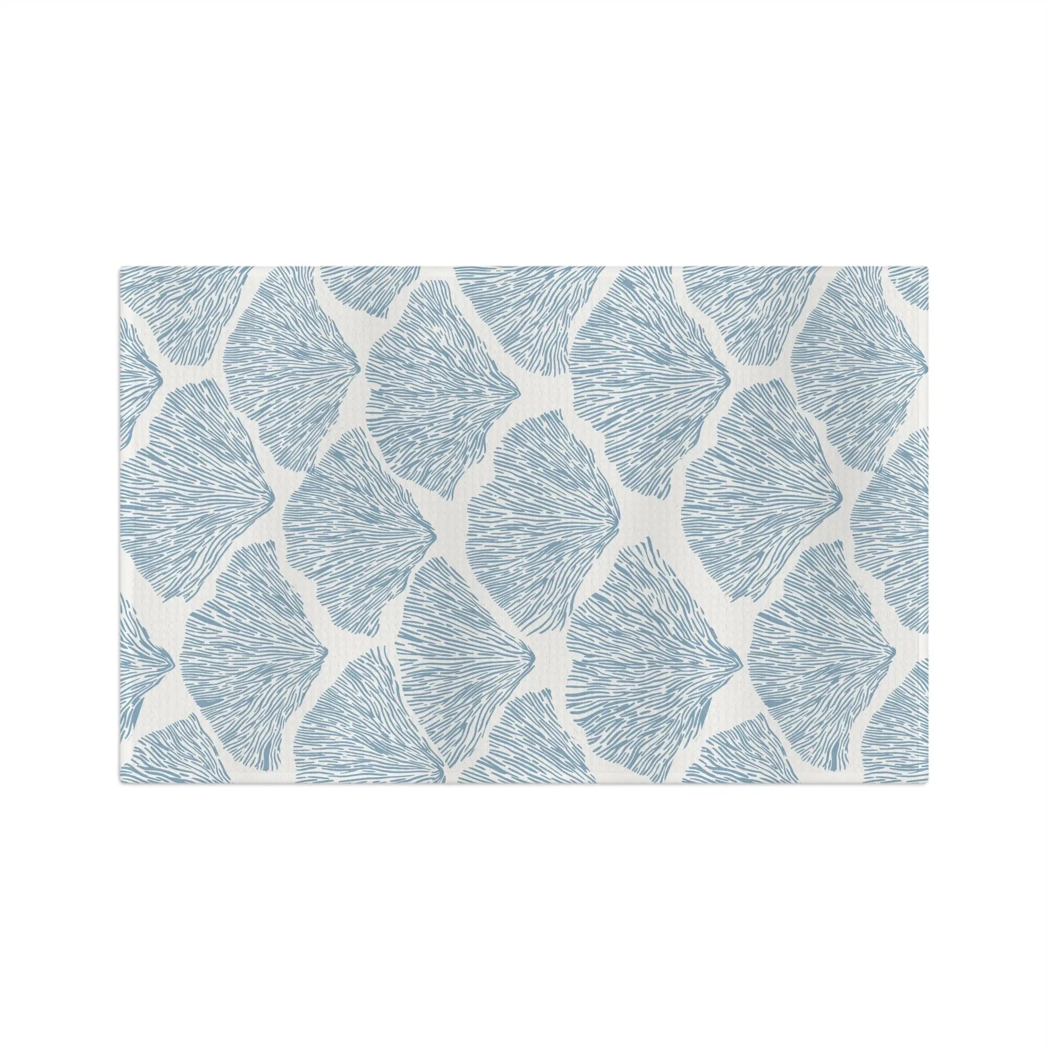 Blue Seashell Microfiber Tea Towel with a repeating seashell pattern on a cream background