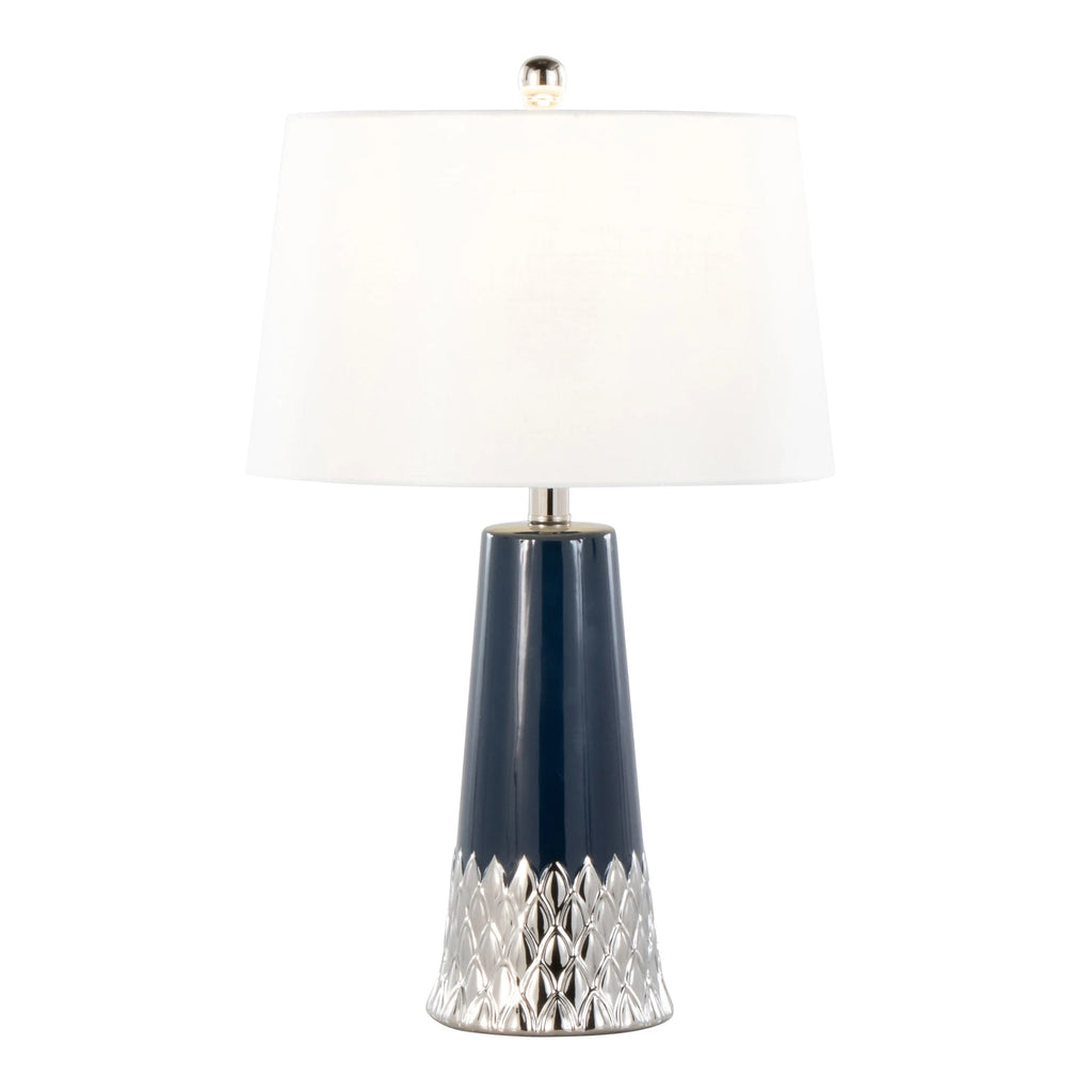 Navy lamp with white shade adding a bold accent to a neutral living room.