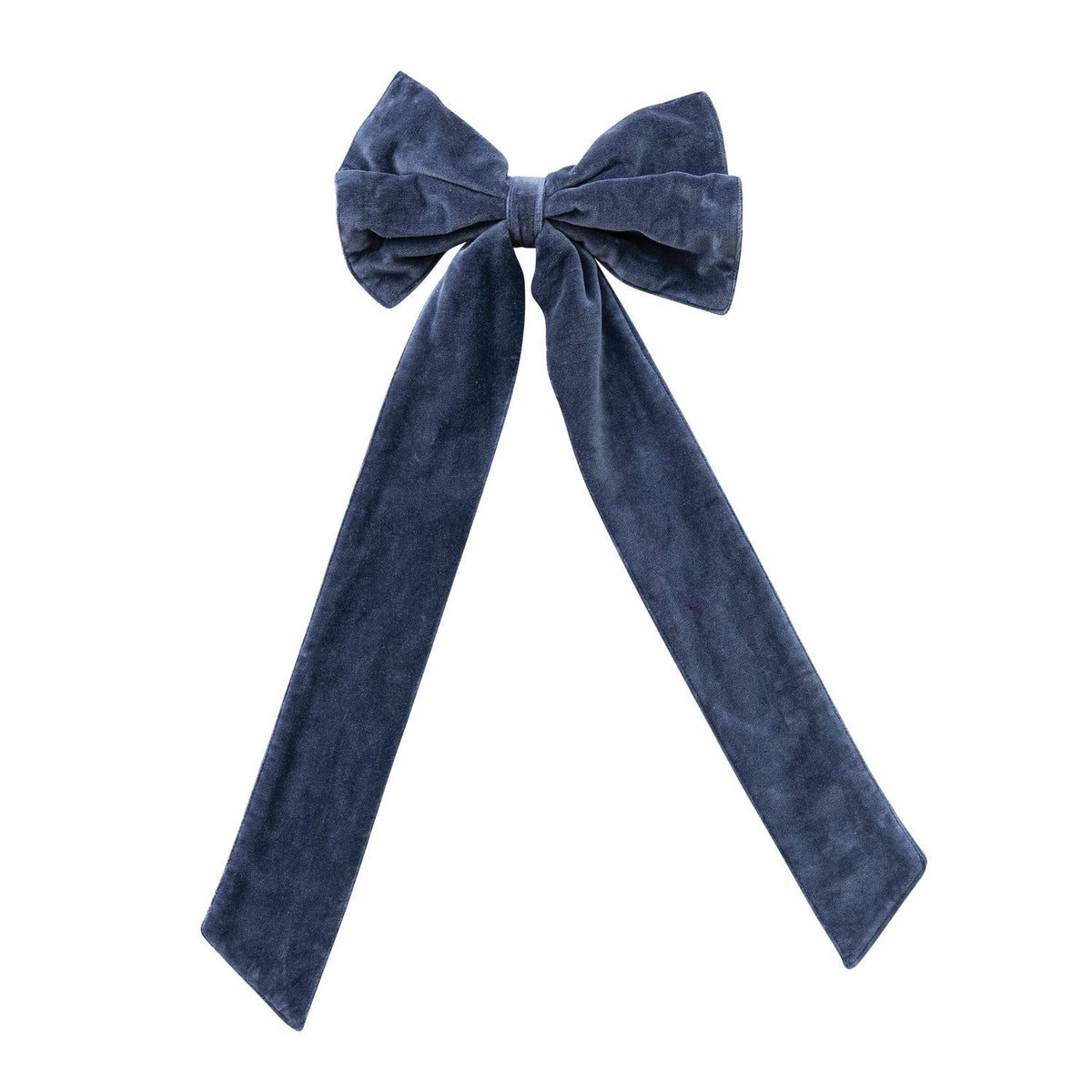 Navy velvet clip-on bow decorating a classic evergreen Christmas wreath.