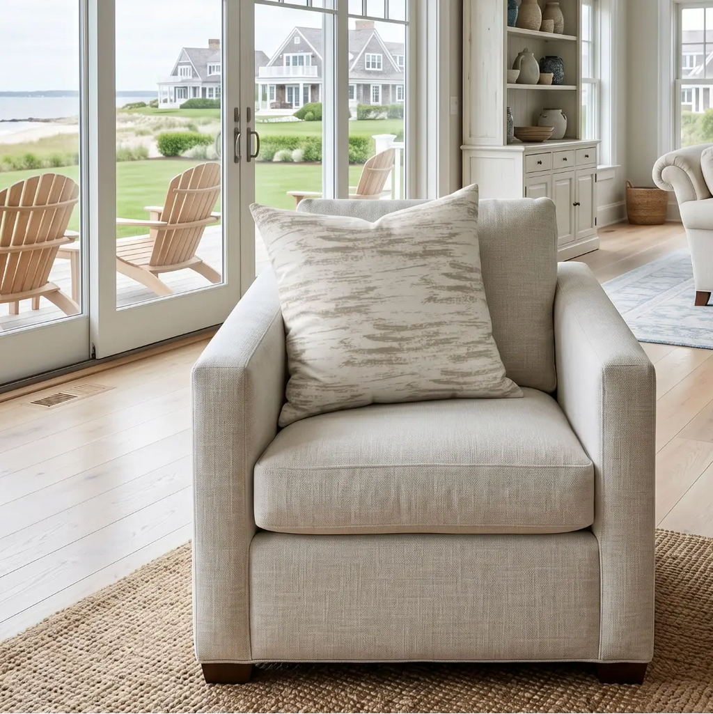 Neutral brushstroke pillow on a sectional sofa in a modern neutral living room