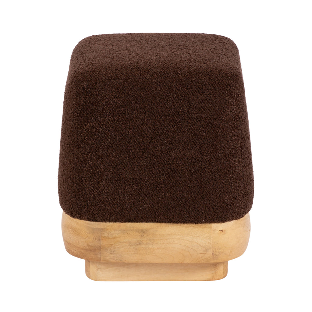 Neutral brown boucle ottoman styled as living room accent furniture