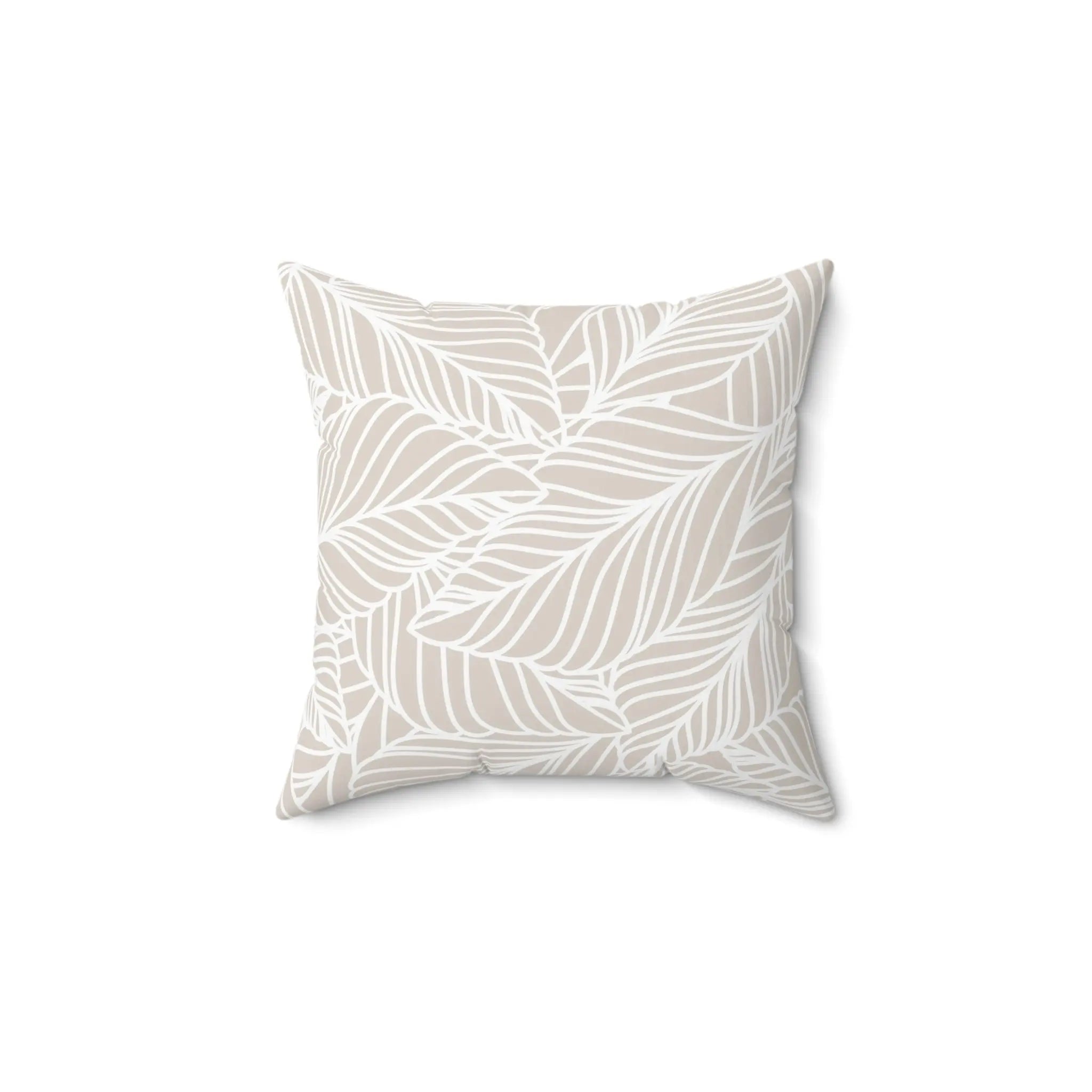 Beige leaf-pattern throw pillow with white leaf outlines on a sand-toned background.