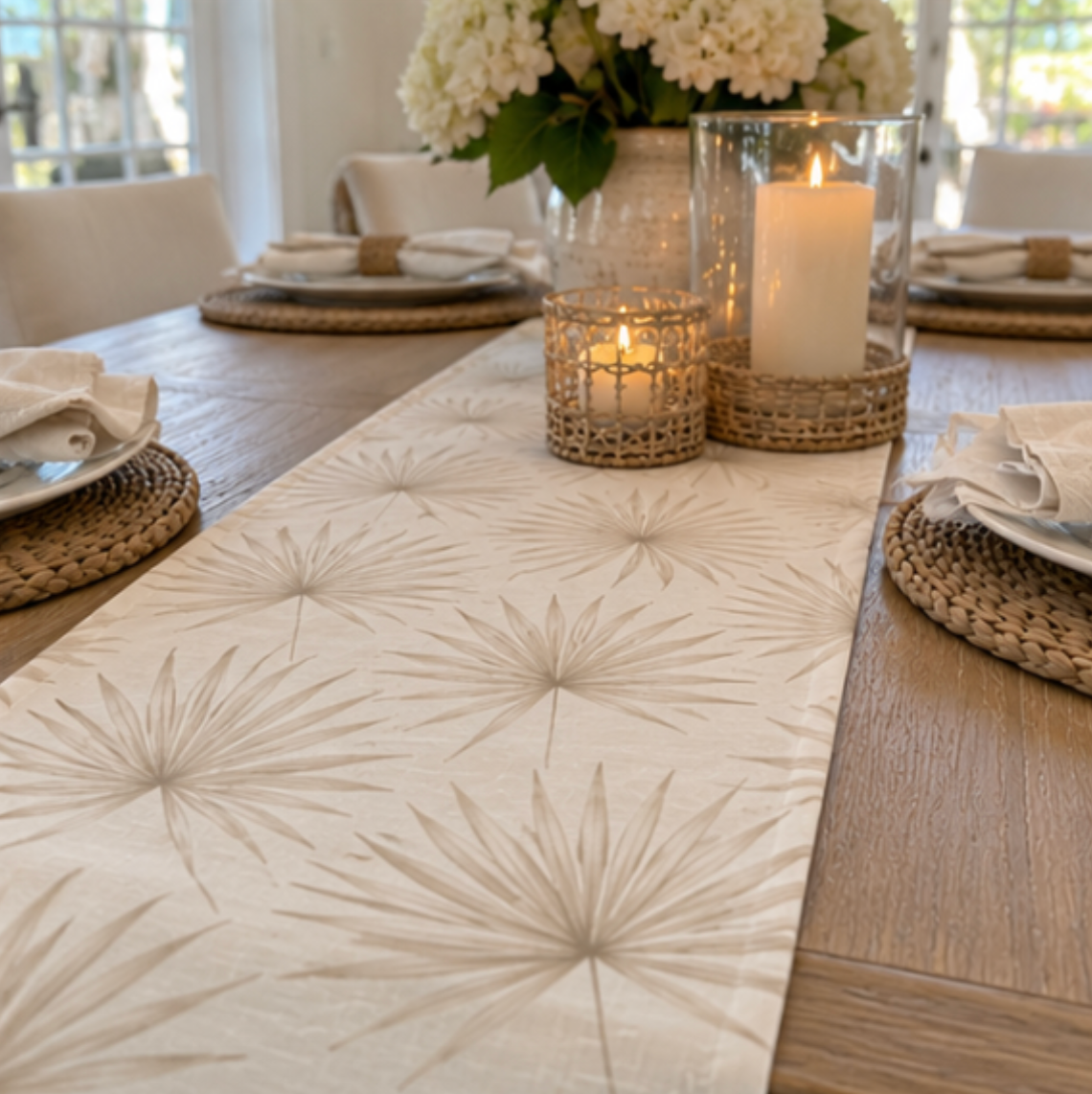 Neutral leaf pattern table runner in soft beige and cream tones.