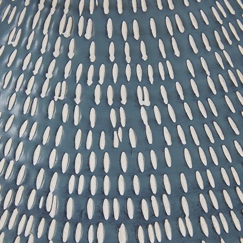 Textured navy blue ceramic table lamp offering a bold yet neutral accent for contemporary interiors.