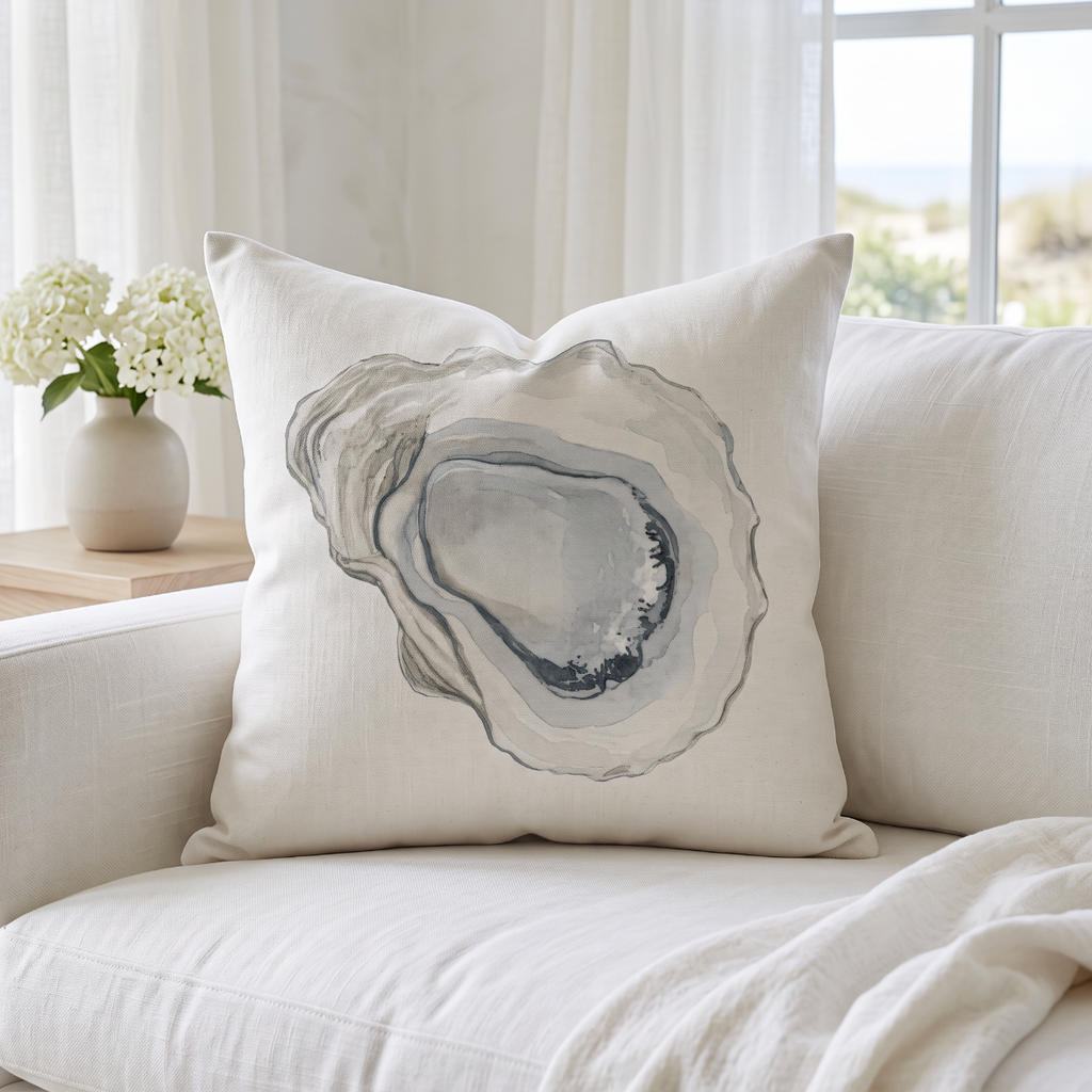Neutral oyster throw pillow for coastal living room decor and beach house styling