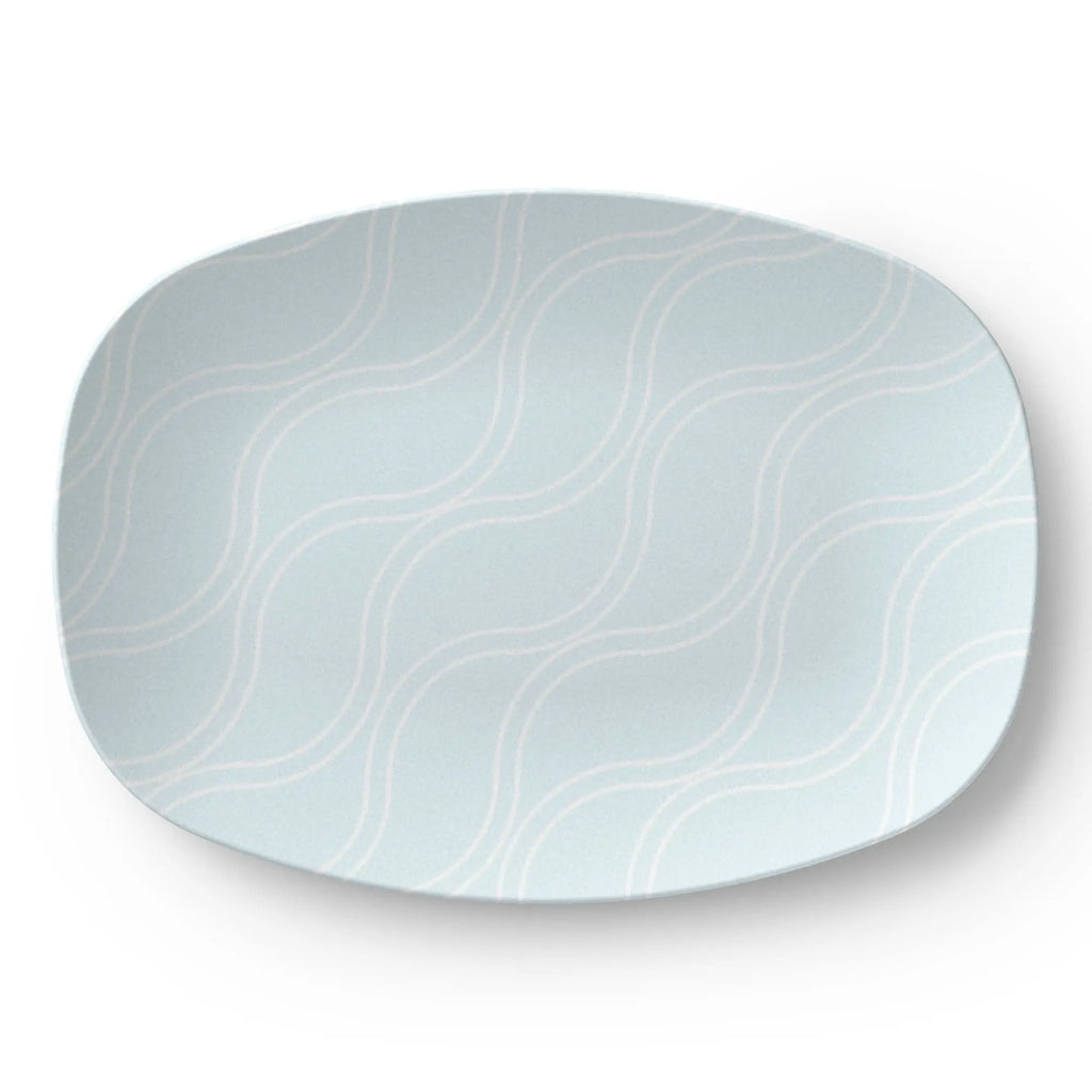 Light blue coastal design serving platter, 10x14-inch oval with white wavy lines.