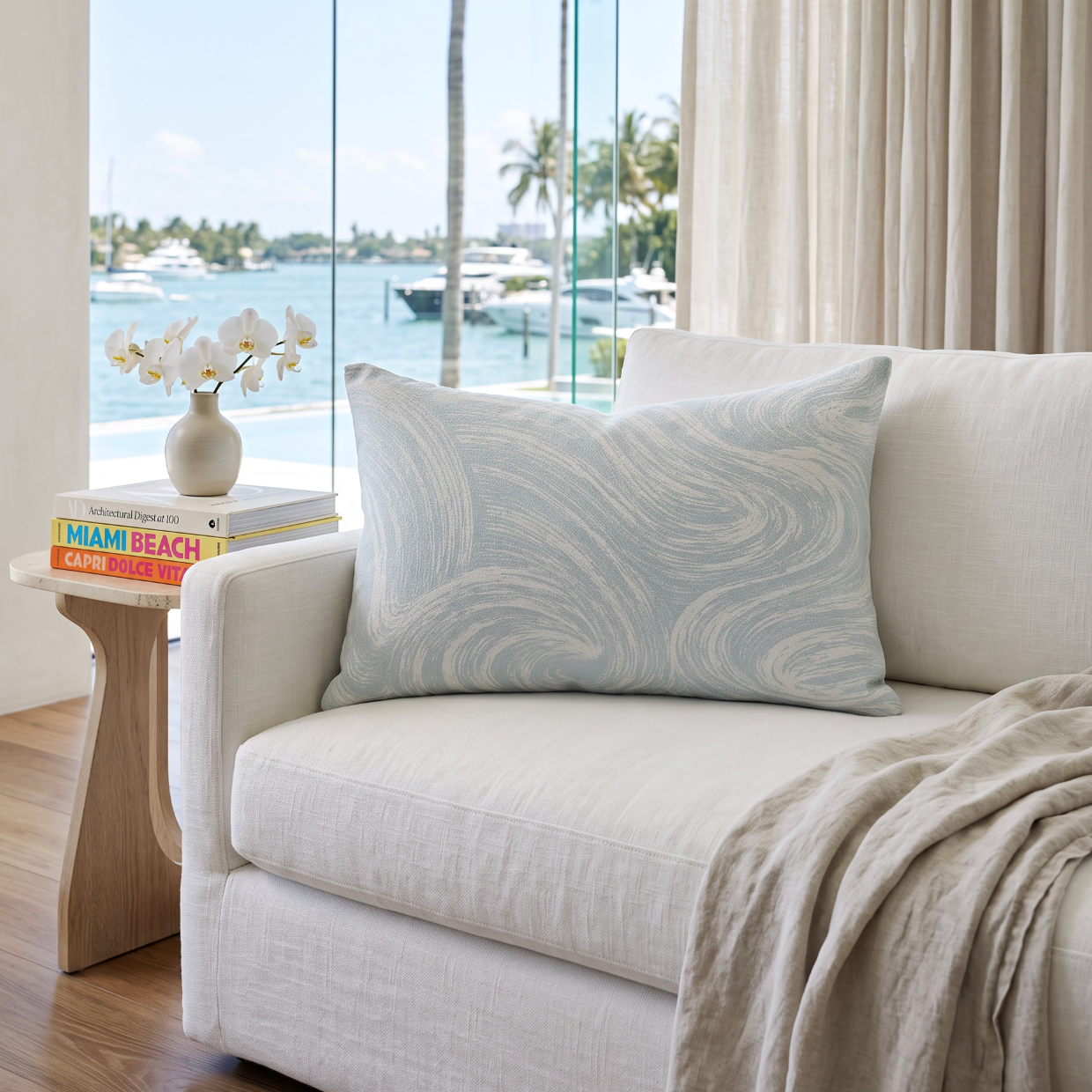 Ocean wave inspired seafoam lumbar pillow designed for a neutral coastal living room or lounge