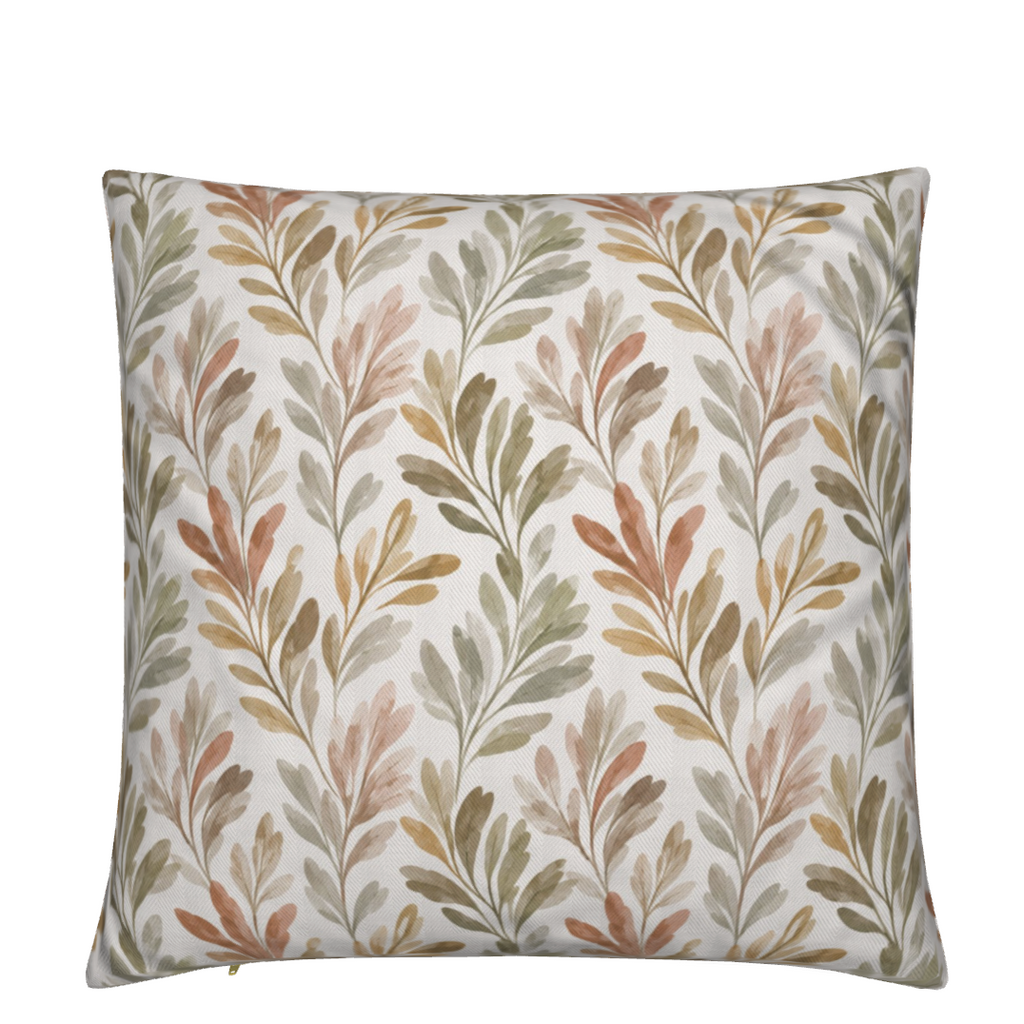 Ivory botanical throw pillow with olive branches in sage green, warm sand, dusty blush, and soft terracotta, styled on a cream coastal sectional sofa.