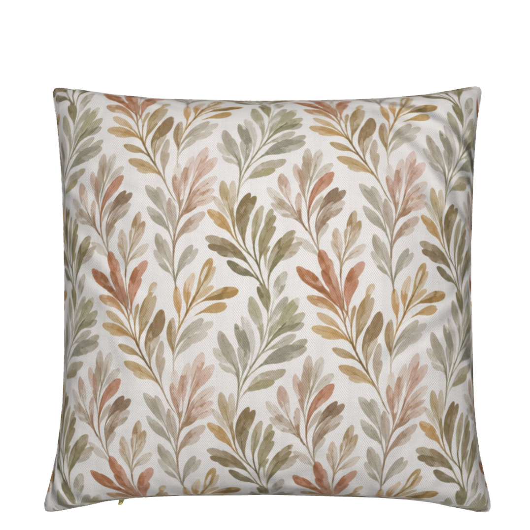 Ivory botanical throw pillow with olive branches in sage green, warm sand, dusty blush, and soft terracotta, styled on a cream coastal sectional sofa.