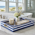 decorative tray with brass accents on bathroom vanity