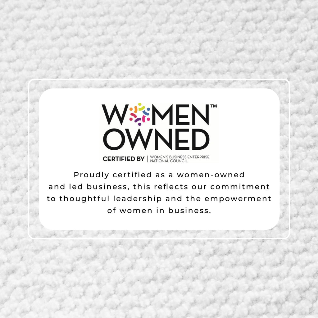Bath towel set image featuring a Women Owned certification badge on a light gray carpet background.