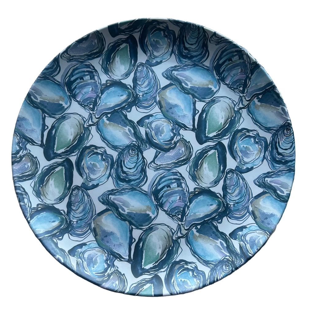 Round oyster serving tray with a blue shell pattern, ideal for presenting oysters.