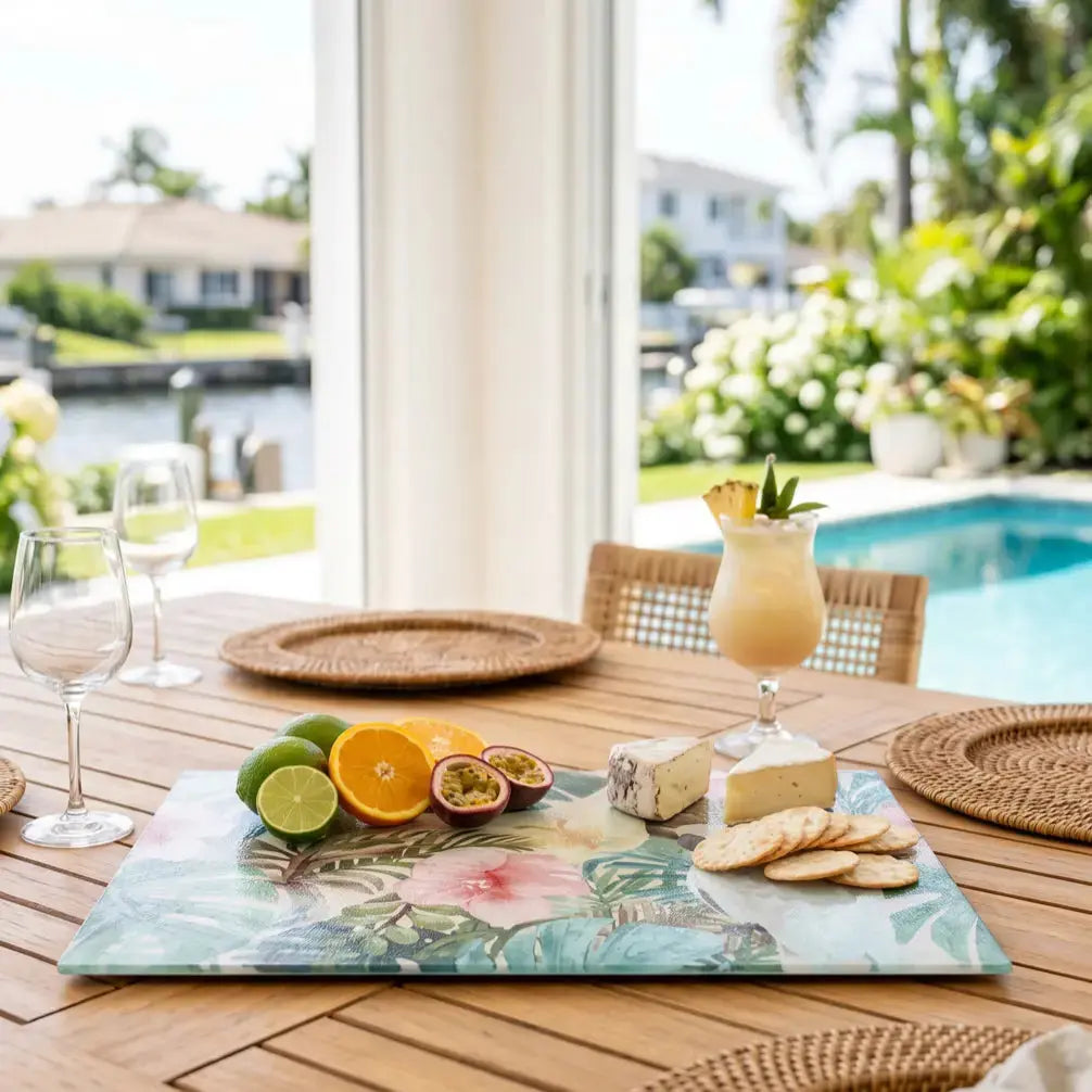 Palm Forest glass cutting board used as a serving tray in a beach house kitchen.