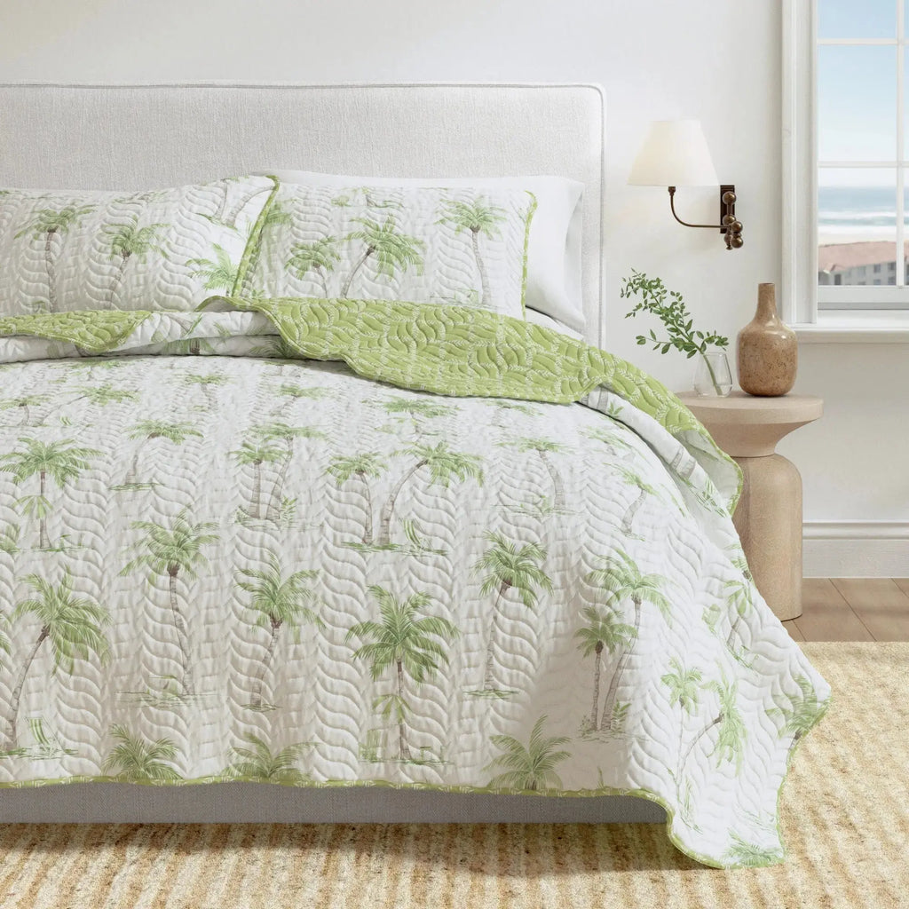 Palm Trees quilt set on a king bed in a tropical resort-inspired coastal room