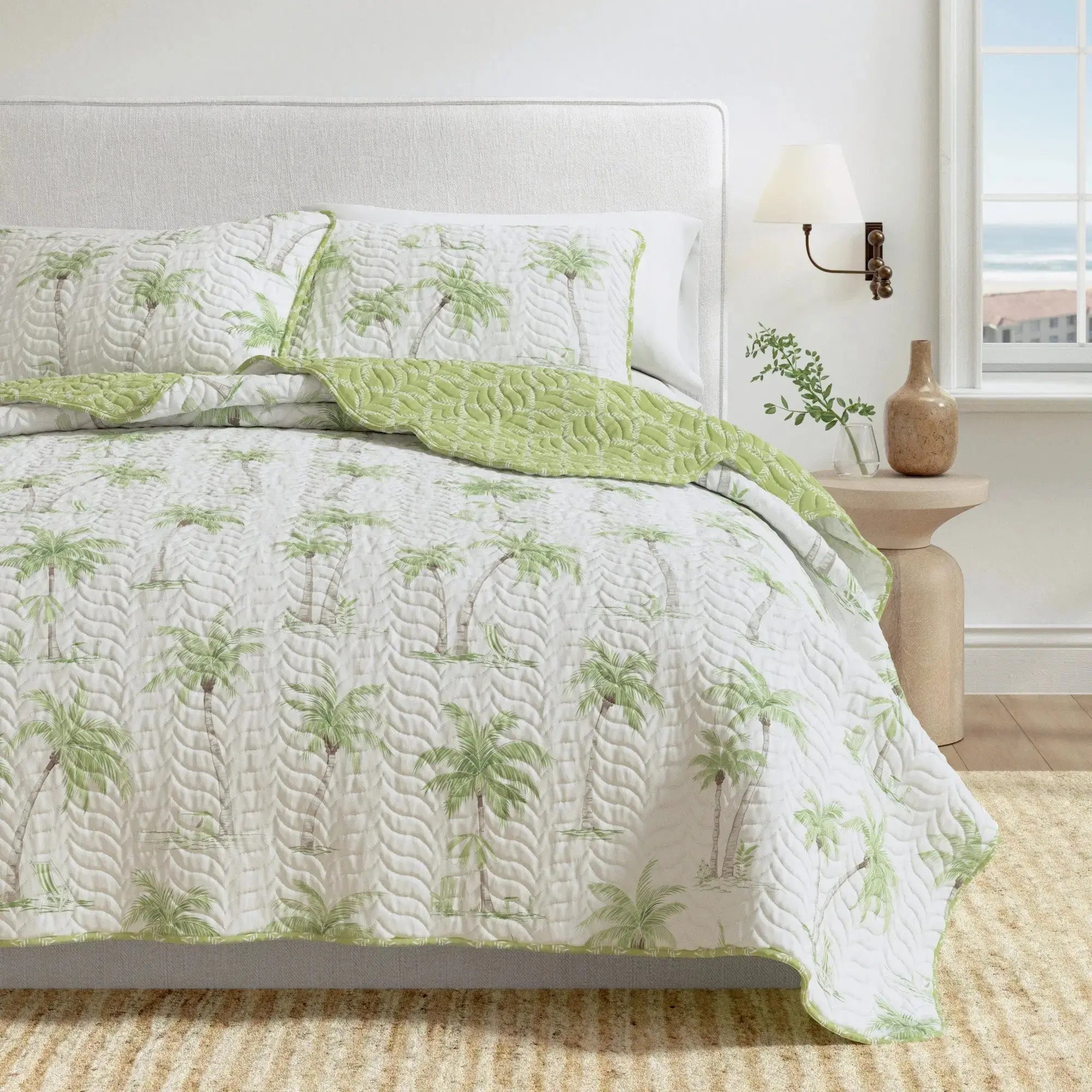 Palm Trees quilt set on a king bed in a tropical resort-inspired coastal room