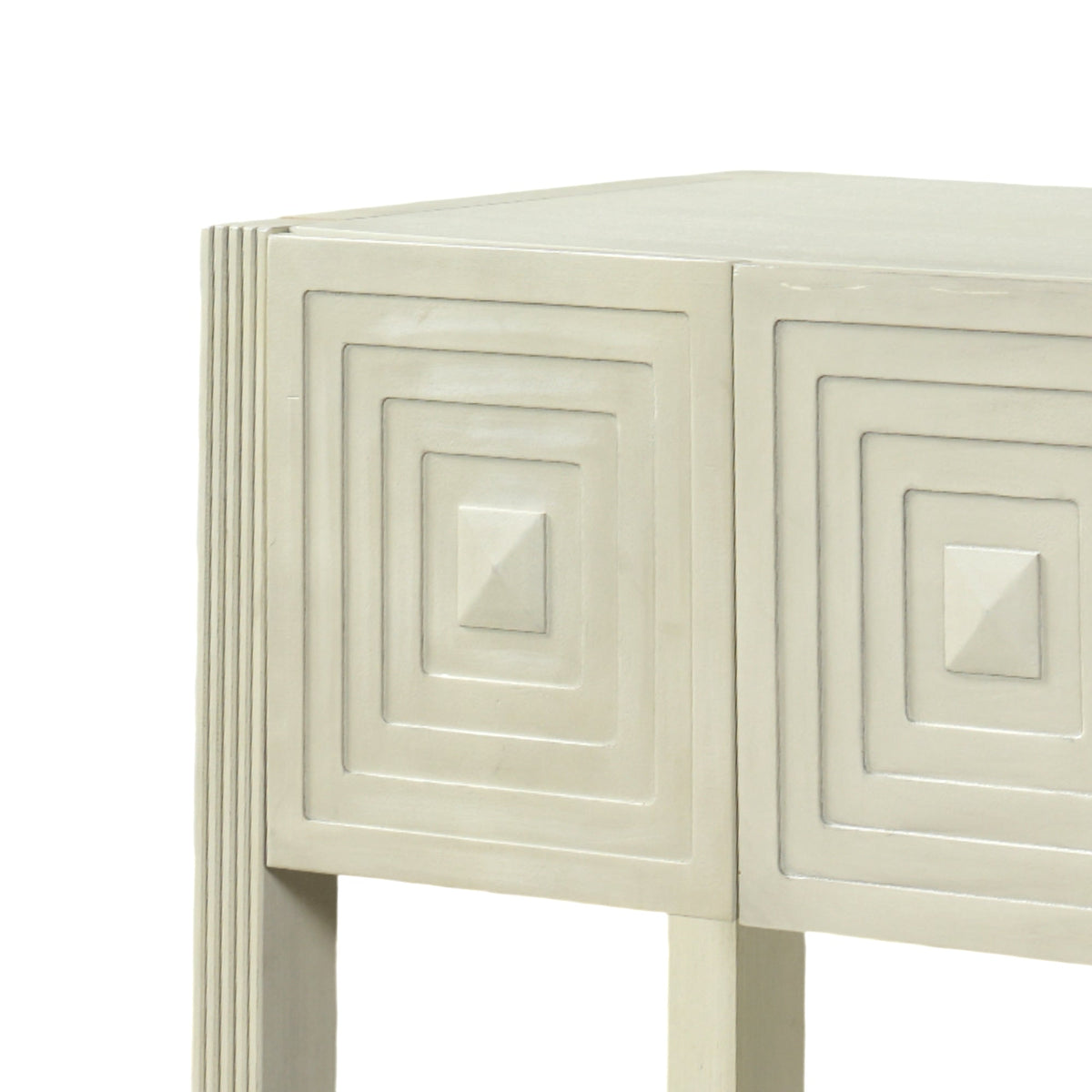Close-up of the decorative geometric carved drawer fronts on the Palmerton console.