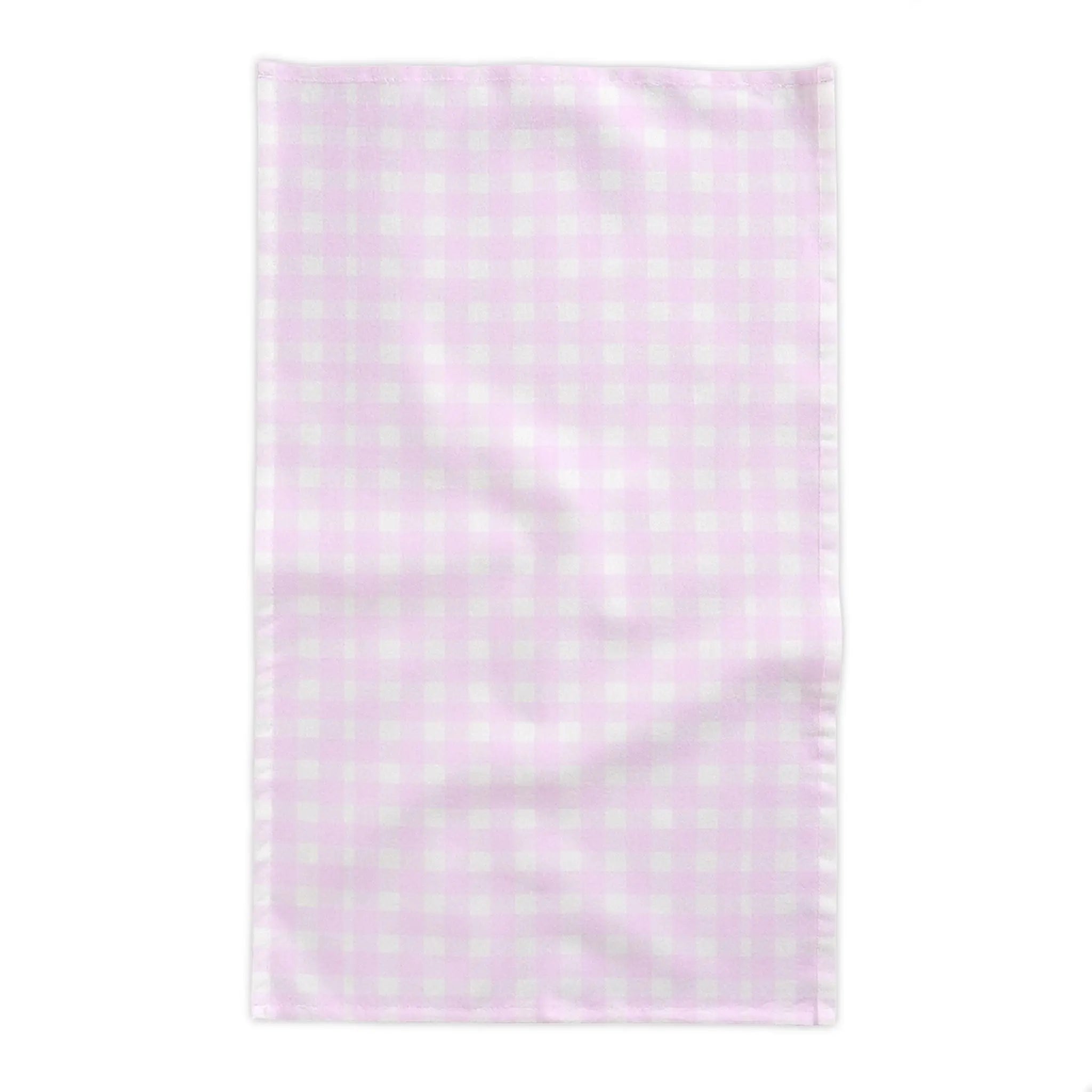 Pink and white gingham tablecloth layered with placemats for a coastal brunch table