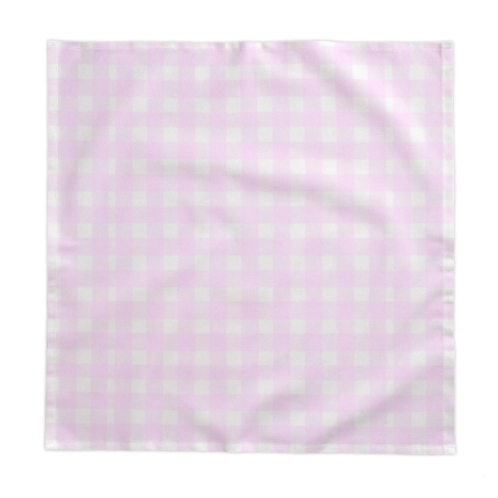 Pink and white gingham tablecloth on a coastal kitchen table with casual place settings