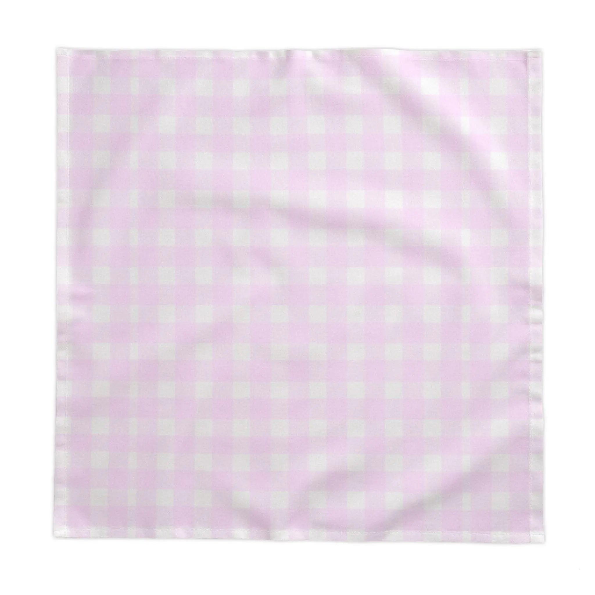 Pink and white gingham tablecloth on a coastal kitchen table with casual place settings