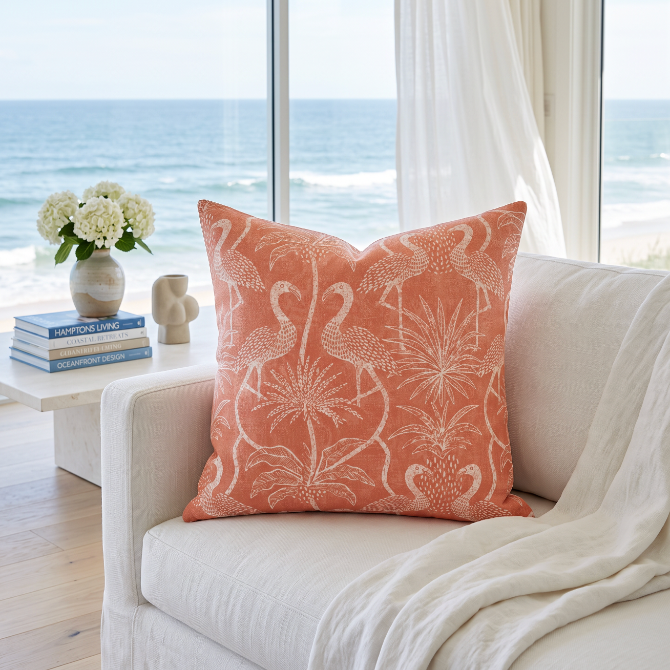Pink flamingo decorative pillow styled on a natural rattan chair in a bright tropical living space.