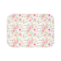 Closeup of pink floral pattern on soft bath mat