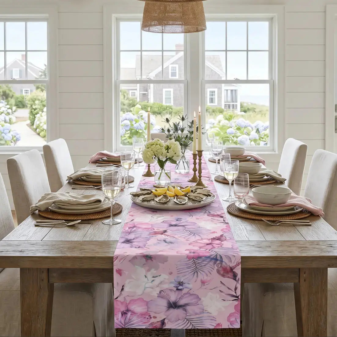 Pink tropical floral table runner styled for summer entertaining in a beach house