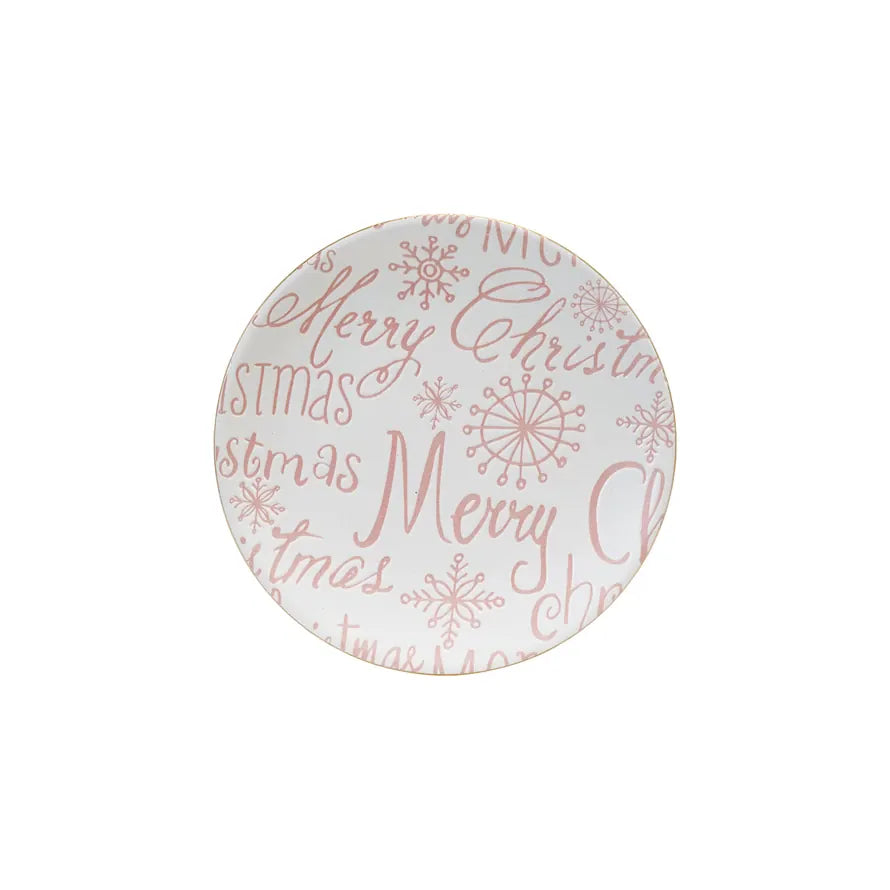 Pink Christmas stoneware dessert plate styled on a kitchen counter with elegant seasonal décor.