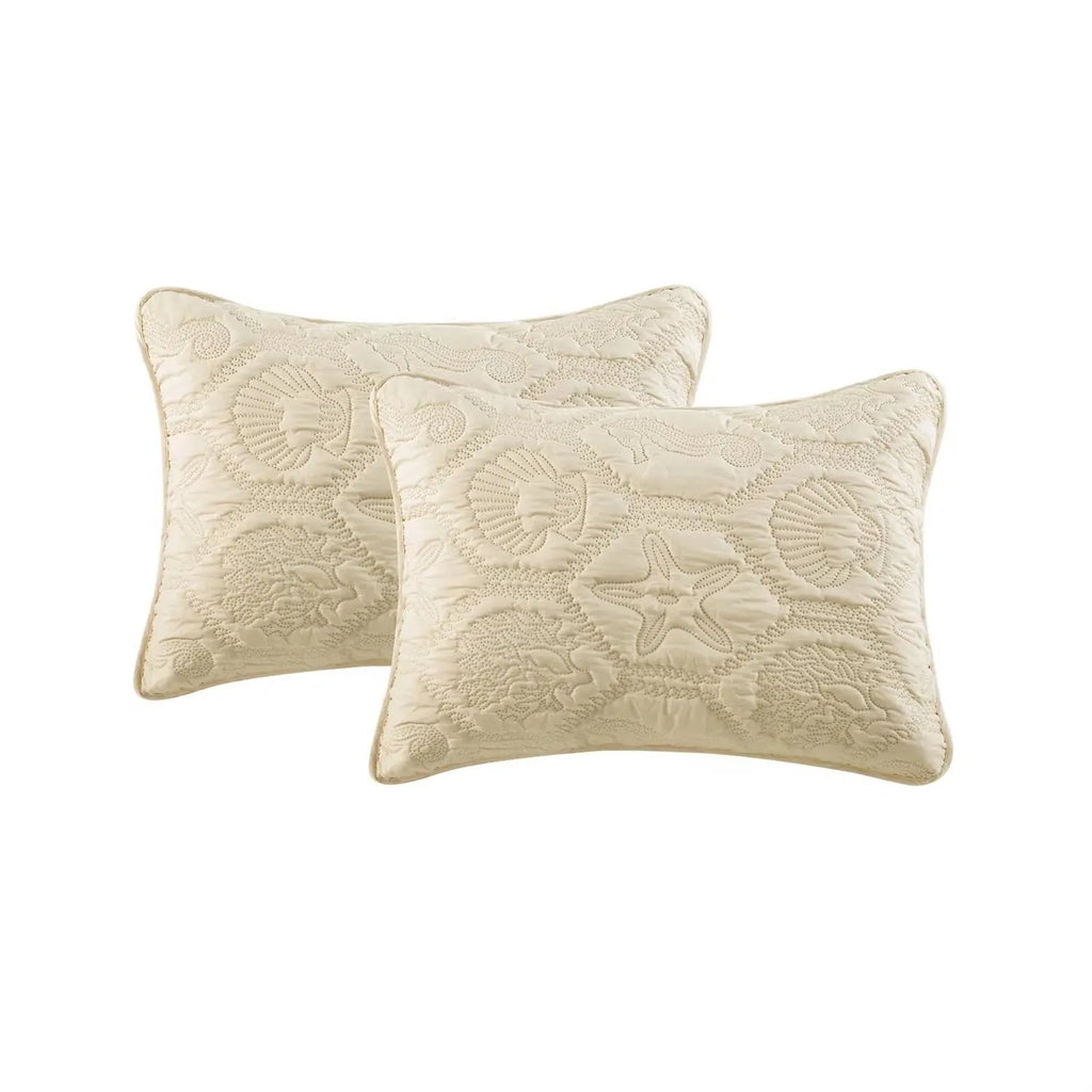 Queen sand tan coastal beach quilt set styled in a light and airy coastal guest room