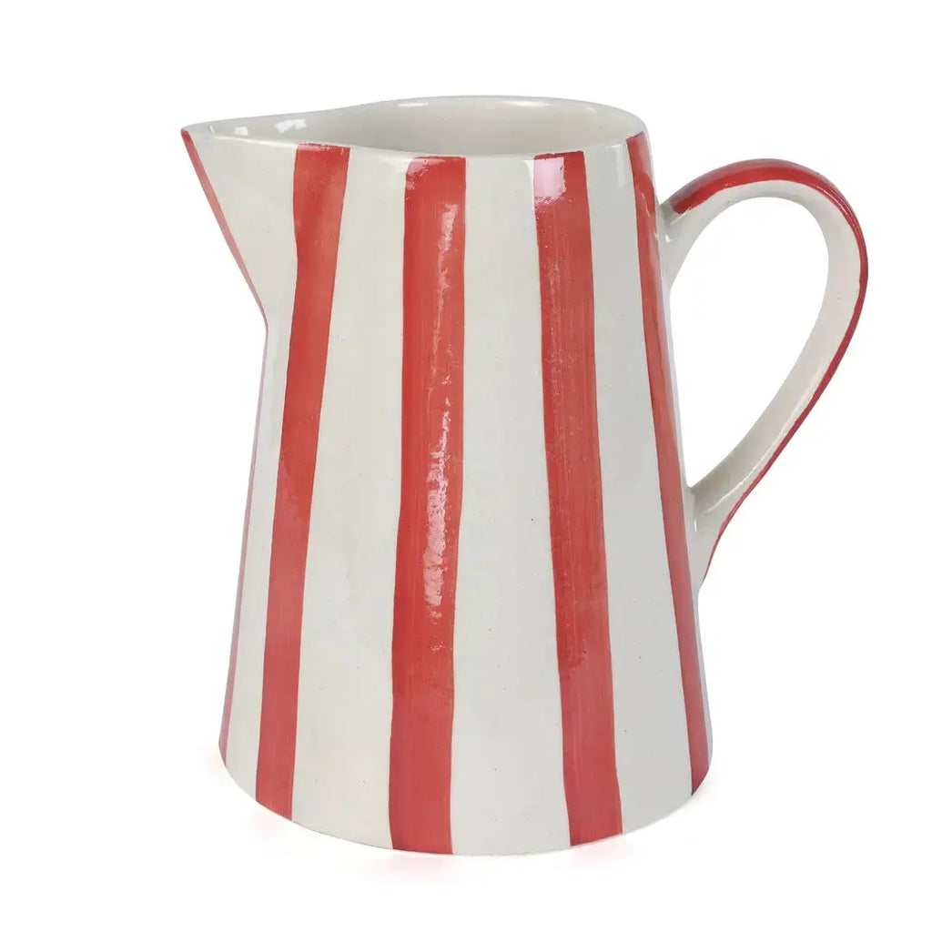 Closeup of red and white striped ceramic pitcher showing painted stripe detail
