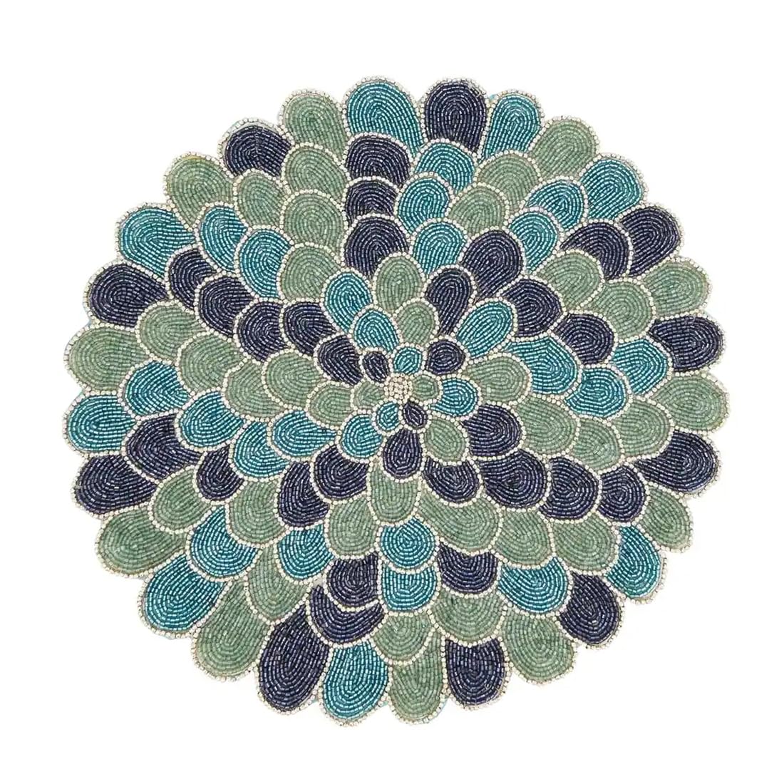 Multi‑tone blue and green beaded placemat forming a circular flower pattern for elegant table settings.