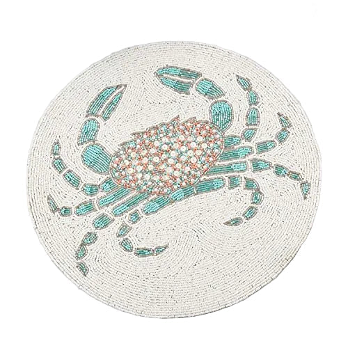 Aqua beaded starfish placemat paired with linen napkins and coral centerpieces for a luxe beach house look.