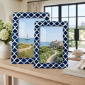 Pair of royal blue and ivory Moroccan resin inlay photo frames from the Casablanca Medianoche collection styled on a console table.