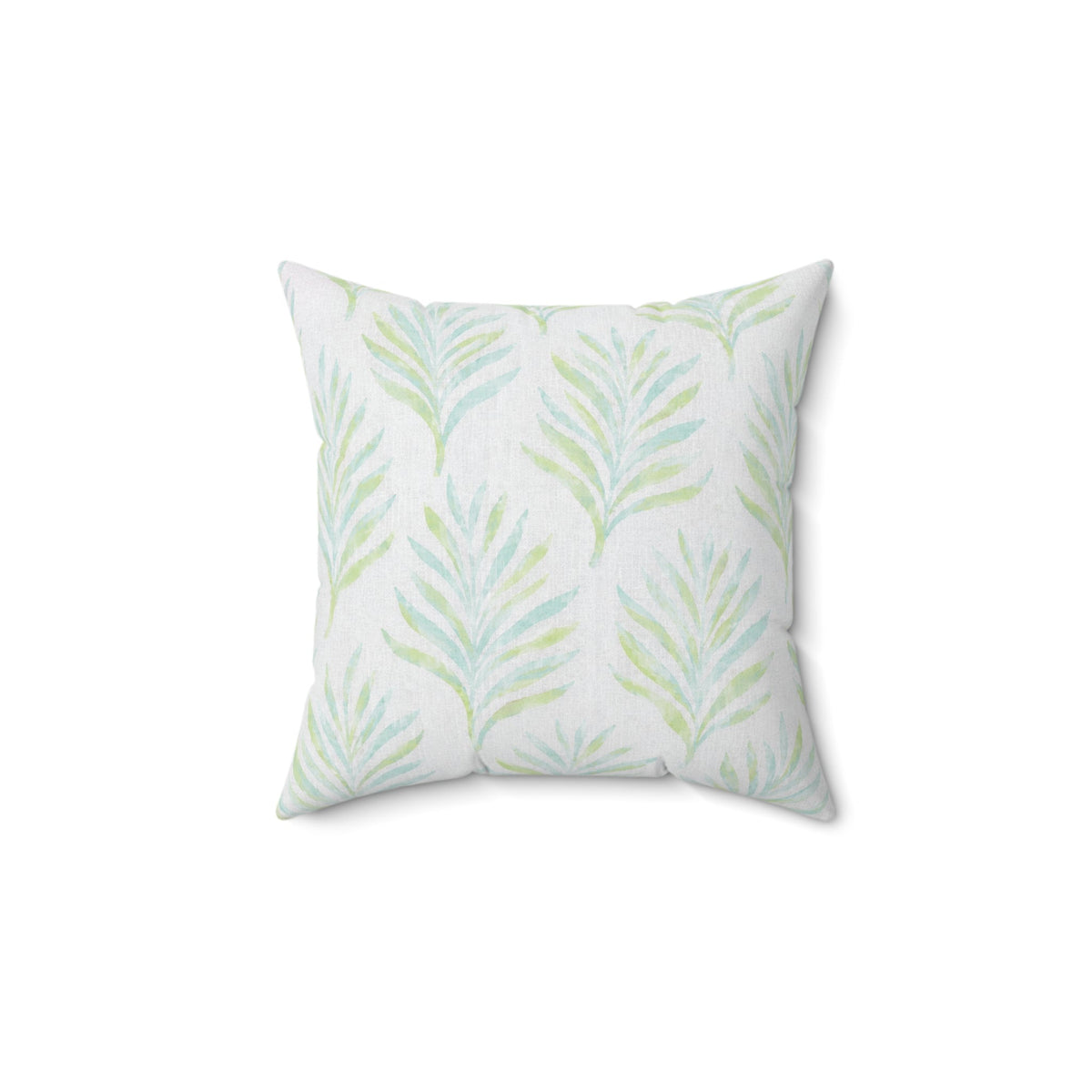 Sage green and blue botanical throw pillow in a coastal living room