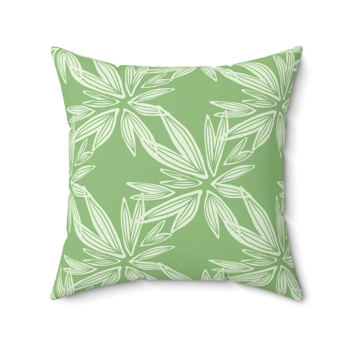 Sage green tropical throw pillow styled for a coastal living room